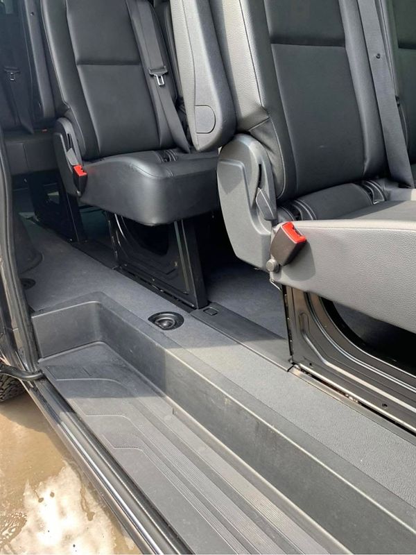 After: the same van's step and bench seats, clean